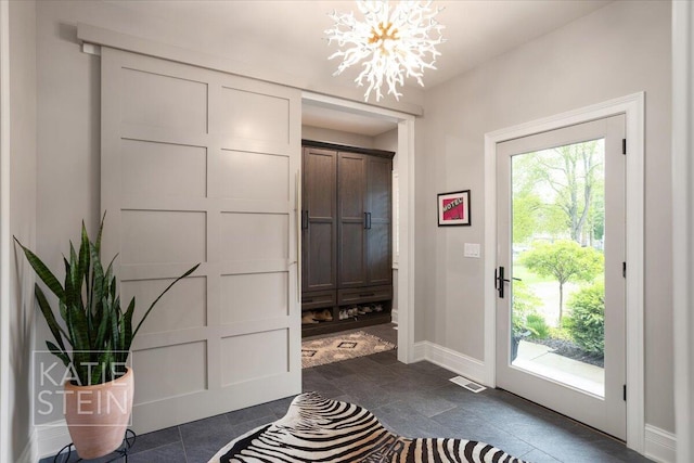 1110 Breton Rd SE, East Grand Rapids, MI 49506 - entrance foyer featuring healthy amount of natural light and a chandelier