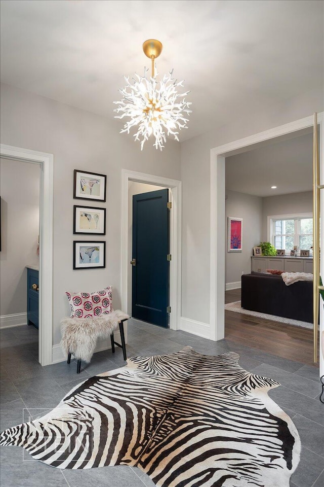 1110 Breton Rd SE, East Grand Rapids, MI 49506 - entrance foyer featuring a chandelier and baseboards