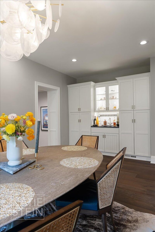 1110 Breton Rd SE, East Grand Rapids, MI 49506 - dining area with dark wood-style flooring, a chandelier, and recessed lighting