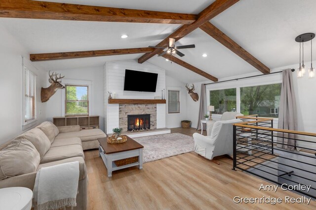 821 W Baseline Rd, Plainwell, MI 49080 - living room featuring wood finished floors, recessed lighting, a stone fireplace, and ceiling fan
