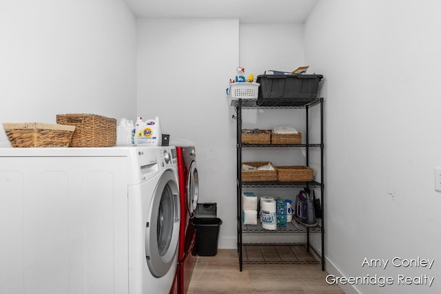 821 W Baseline Rd, Plainwell, MI 49080 - washroom with washing machine and dryer and wood finished floors