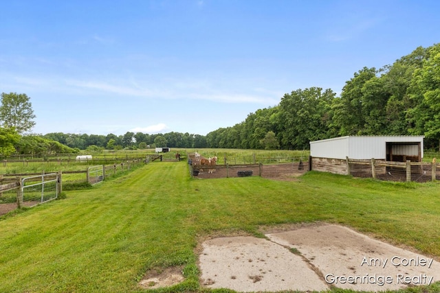 821 W Baseline Rd, Plainwell, MI 49080 - view of green lawn with a view of countryside, an outbuilding, and an exterior structure