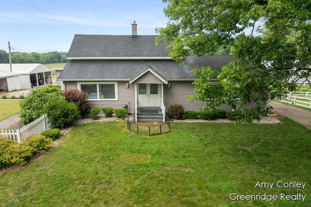 821 W Baseline Rd, Plainwell, MI 49080 - view of front of property featuring a shingled roof and a chimney