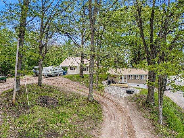 5729 N Bass Lake Rd, Irons, MI 49644 - view of front of house featuring driveway