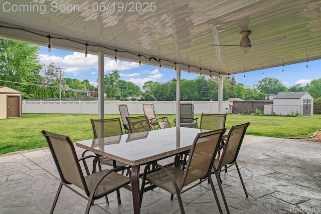 39502 Salvatore Dr, Sterling Heights, MI 48313 - fenced backyard with a storage shed, outdoor dining area, a patio, and ceiling fan