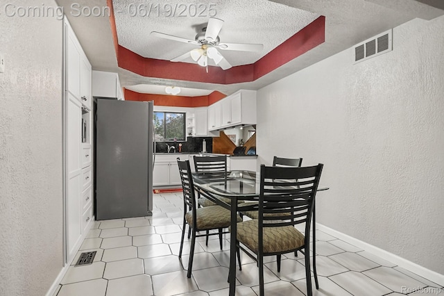 39502 Salvatore Dr, Sterling Heights, MI 48313 - dining area with a textured wall, a textured ceiling, and a ceiling fan