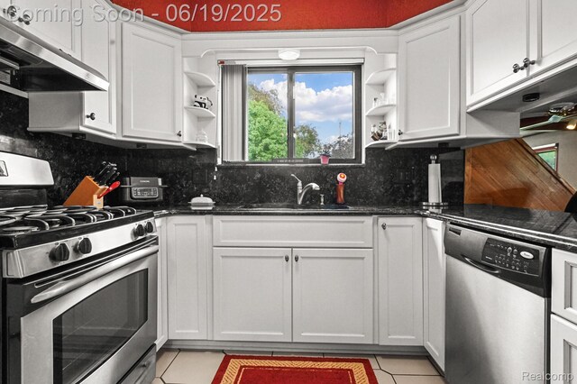 39502 Salvatore Dr, Sterling Heights, MI 48313 - kitchen featuring appliances with stainless steel finishes, extractor fan, open shelves, and light tile patterned flooring