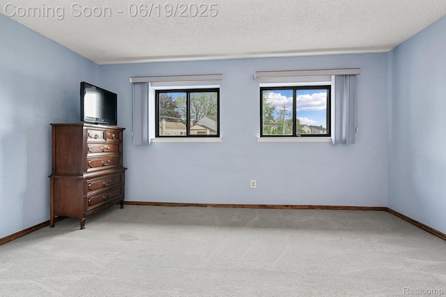 39502 Salvatore Dr, Sterling Heights, MI 48313 - unfurnished bedroom with light carpet and a textured ceiling