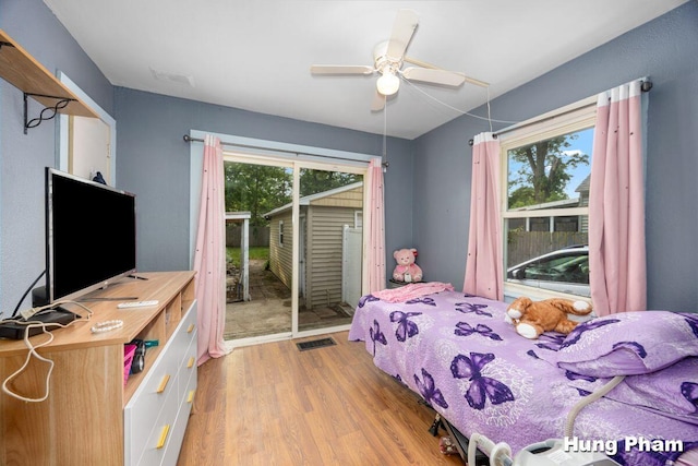 3064 Brookfield Ave NE, Grand Rapids, MI 49505 - bedroom featuring access to exterior, light wood finished floors, multiple windows, and a ceiling fan