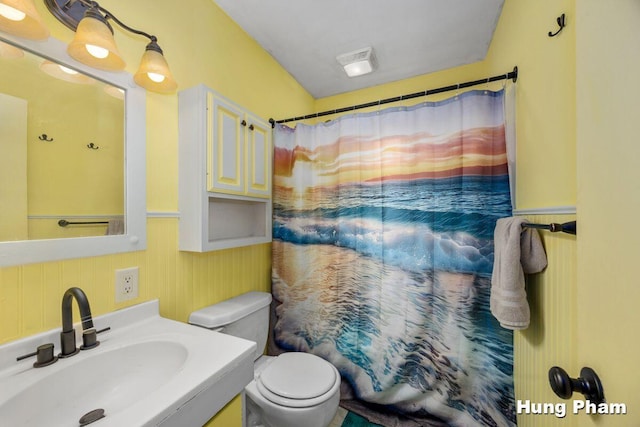 3064 Brookfield Ave NE, Grand Rapids, MI 49505 - full bath with vanity, a wainscoted wall, a shower with shower curtain, and wooden walls
