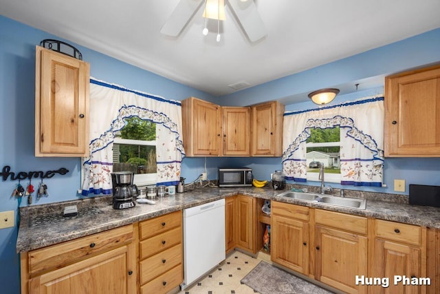 3064 Brookfield Ave NE, Grand Rapids, MI 49505 - kitchen featuring white dishwasher, stainless steel microwave, dark countertops, a ceiling fan, and light floors