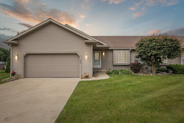 340 E 4th St, Onsted, MI 49265 - view of front of property featuring driveway, a front yard, a garage, and roof with shingles