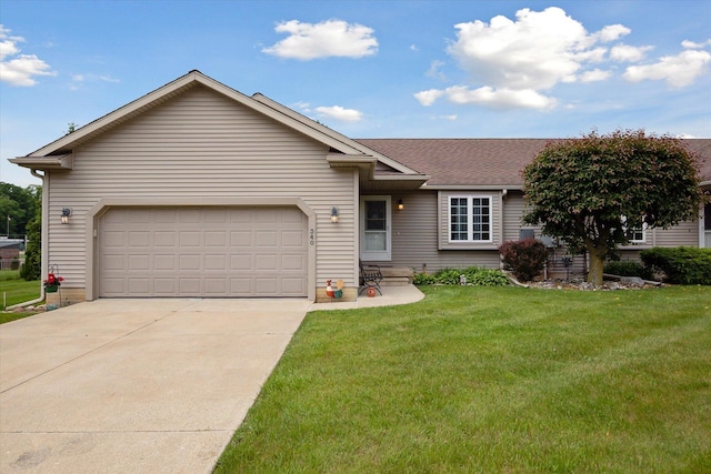 340 E 4th St, Onsted, MI 49265 - single story home featuring driveway, a front lawn, a shingled roof, and a garage