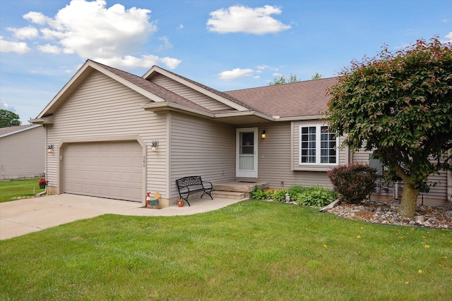 340 E 4th St, Onsted, MI 49265 - ranch-style home with an attached garage, driveway, a front yard, and roof with shingles