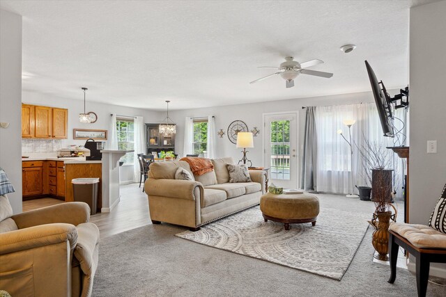 340 E 4th St, Onsted, MI 49265 - living room with ceiling fan and a chandelier