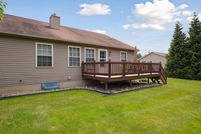 340 E 4th St, Onsted, MI 49265 - rear view of property featuring a wooden deck, a lawn, a chimney, and roof with shingles