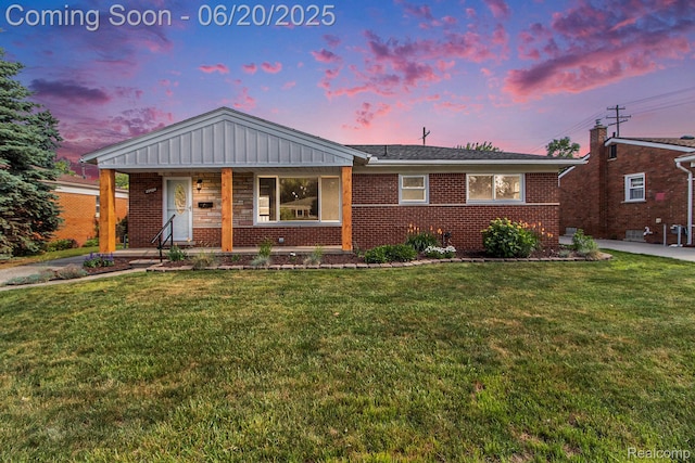 29424 Oakley St, Livonia, MI 48154 - ranch-style home featuring brick siding, a yard, and a porch