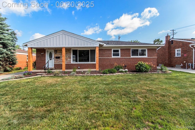29424 Oakley St, Livonia, MI 48154 - ranch-style house with brick siding, a front lawn, and covered porch