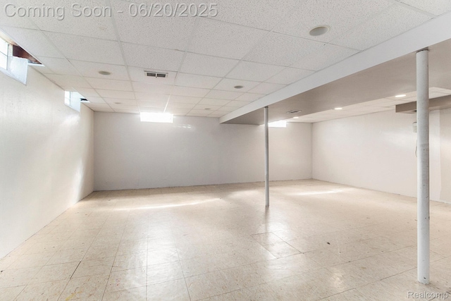29424 Oakley St, Livonia, MI 48154 - below grade area featuring tile patterned floors and a paneled ceiling