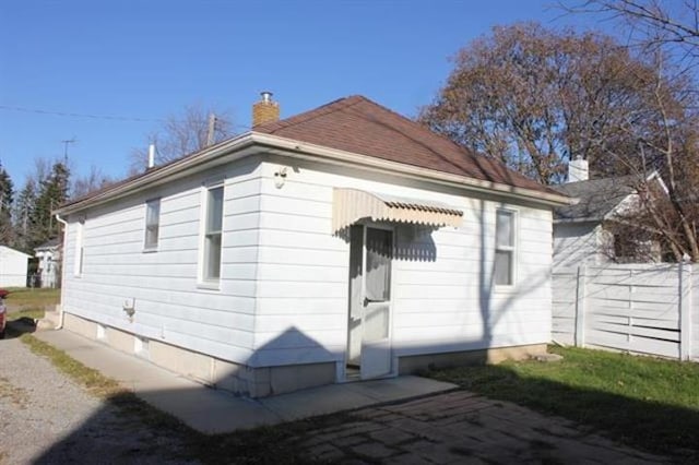 2913 Gibson St, Flint, MI 48503 - back of house featuring a chimney