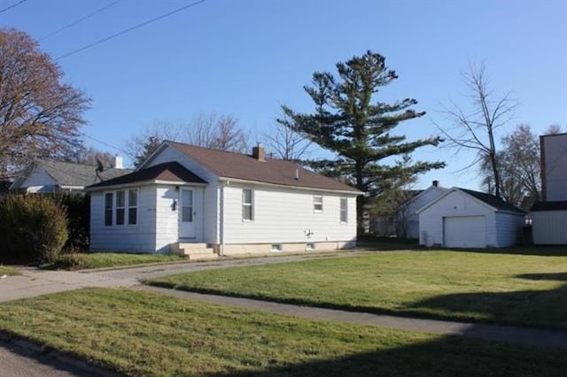 2913 Gibson St, Flint, MI 48503 - view of front of house featuring a front yard, a detached garage, an outdoor structure, a chimney, and entry steps