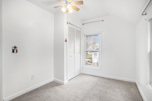 144 E Hickory Rd, Battle Creek, MI 49017 - unfurnished bedroom with light colored carpet, lofted ceiling, a closet, and ceiling fan