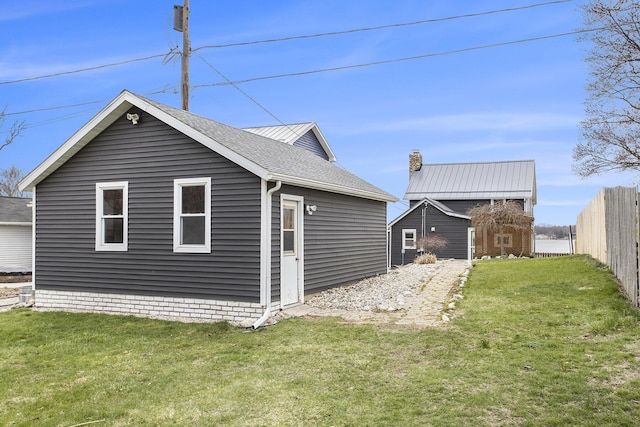 144 E Hickory Rd, Battle Creek, MI 49017 - view of side of home with roof with shingles and an outdoor structure