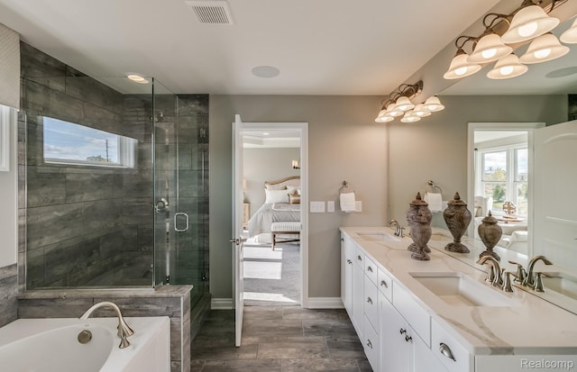 6216 Marsh, Ypsilanti, MI 48197 - ensuite bathroom featuring double vanity, a garden tub, and a stall shower