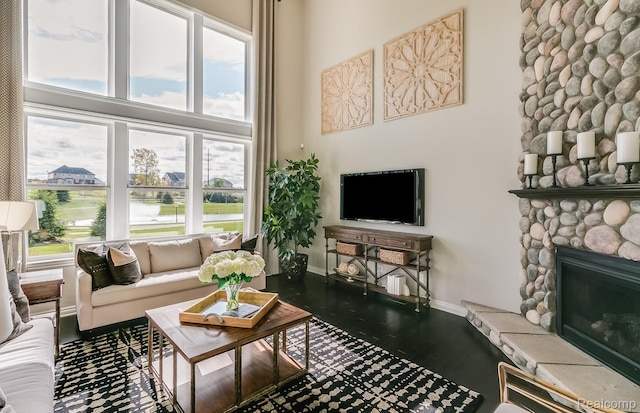 6216 Marsh, Ypsilanti, MI 48197 - living area with a towering ceiling, a fireplace, and dark wood finished floors