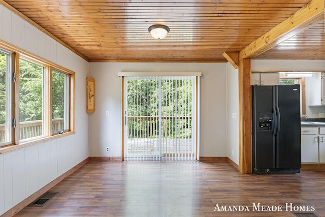 443 Nicholson St, Ionia, MI 48846 - unfurnished dining area with plenty of natural light, wooden ceiling, crown molding, wood finished floors, and wooden walls