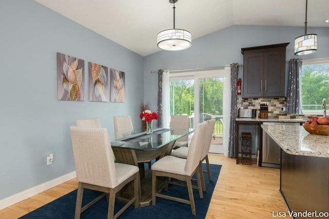 1706 Steff Ct SW, Wyoming, MI 49519 - dining area with light wood-style floors and lofted ceiling