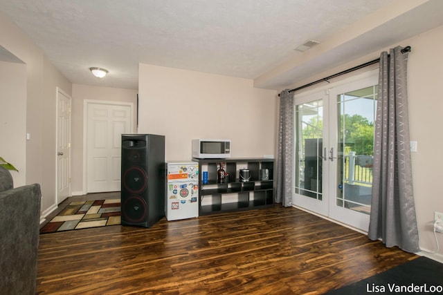 1706 Steff Ct SW, Wyoming, MI 49519 - unfurnished living room with wood finished floors and french doors