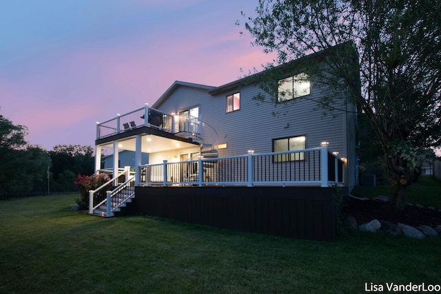 1706 Steff Ct SW, Wyoming, MI 49519 - rear view of house with a balcony and a lawn