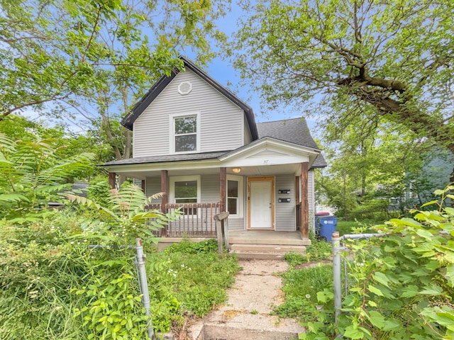 37 Caledonia St NE, Grand Rapids, MI 49505 - view of front of house with a porch and roof with shingles