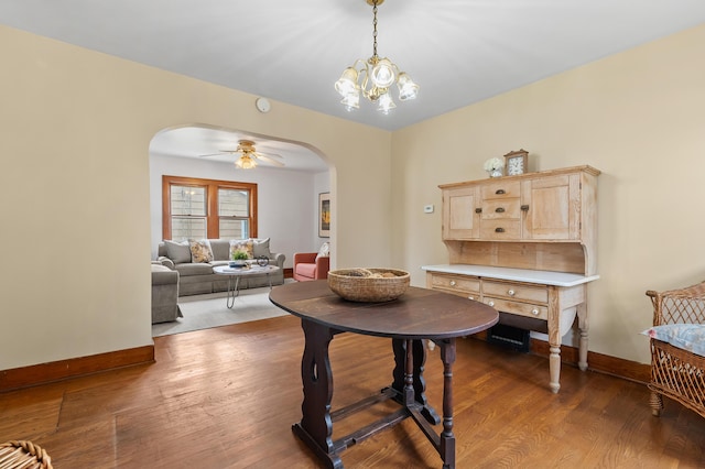 716 Price St, Saint Joseph, MI 49085 - dining space featuring arched walkways, wood finished floors, ceiling fan, and a chandelier