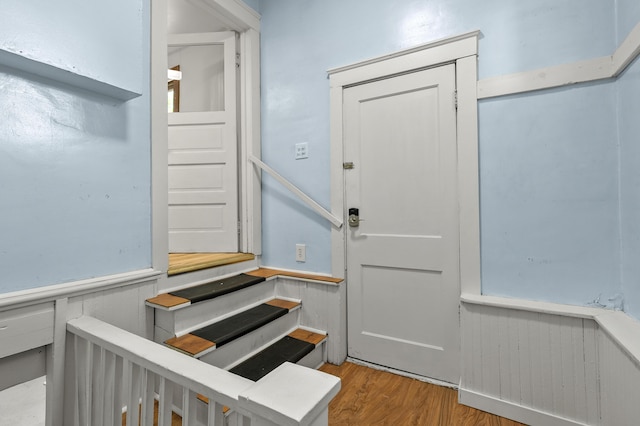 716 Price St, Saint Joseph, MI 49085 - staircase with wainscoting and wood finished floors