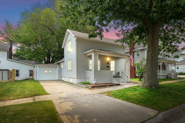 716 Price St, Saint Joseph, MI 49085 - view of front of house with driveway, covered porch, a yard, an outbuilding, and roof with shingles