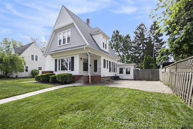 16 E Pine St, Fremont, MI 49412 - view of front of property featuring a shingled roof, a chimney, and a patio area