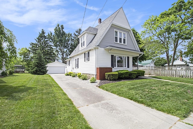 16 E Pine St, Fremont, MI 49412 - view of front of home with an outdoor structure, a detached garage, and roof with shingles