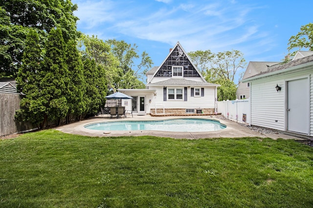 16 E Pine St, Fremont, MI 49412 - back of property featuring a fenced backyard and a patio area
