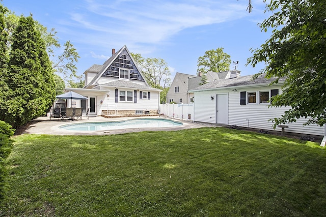 16 E Pine St, Fremont, MI 49412 - back of property with a chimney, a patio, and outdoor dining area