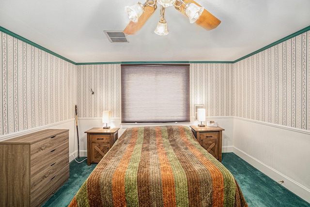 16 E Pine St, Fremont, MI 49412 - bedroom with dark colored carpet, a wainscoted wall, wallpapered walls, and a ceiling fan