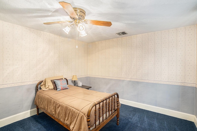 16 E Pine St, Fremont, MI 49412 - carpeted bedroom with a ceiling fan, wainscoting, and wallpapered walls