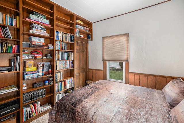 16 E Pine St, Fremont, MI 49412 - carpeted bedroom featuring a wainscoted wall and wood walls