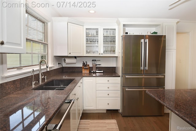 32965 Franklin Ct, Franklin, MI 48025 - kitchen with stainless steel appliances, white cabinetry, dark wood-style floors, dark stone counters, and glass insert cabinets