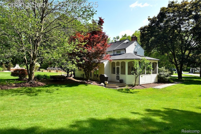 32965 Franklin Ct, Franklin, MI 48025 - back of property with a yard, a shingled roof, and a chimney
