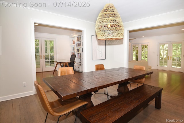 32965 Franklin Ct, Franklin, MI 48025 - dining area featuring french doors, ornamental molding, healthy amount of natural light, and wood finished floors