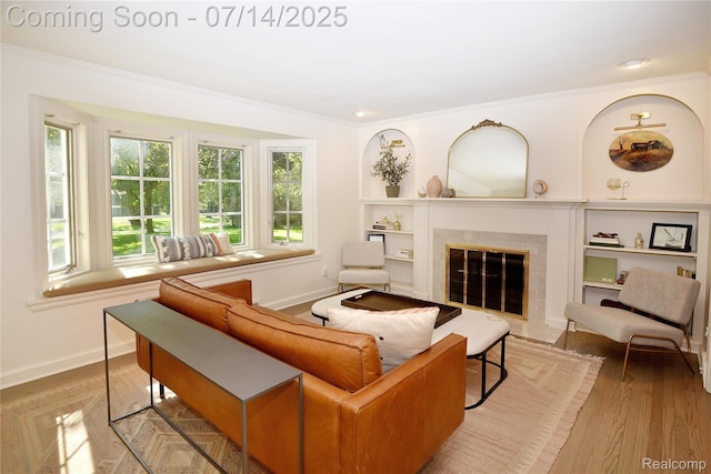 32965 Franklin Ct, Franklin, MI 48025 - living room with crown molding, a fireplace, built in shelves, wood finished floors, and recessed lighting