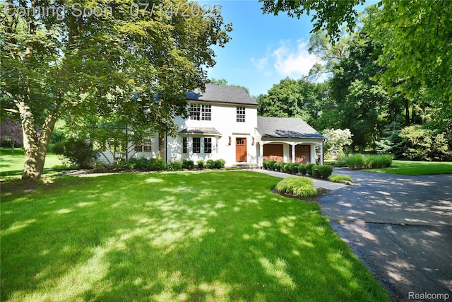 32965 Franklin Ct, Franklin, MI 48025 - view of front of property with driveway, a front lawn, and an attached garage