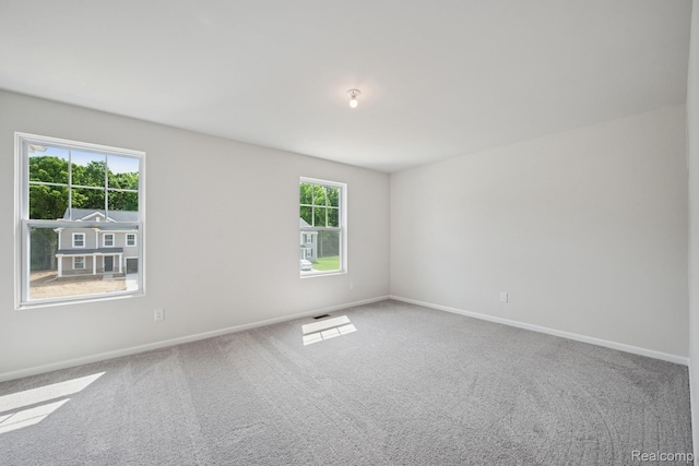 4311 Oak St, Grand Blanc, MI 48439 - spare room with baseboards and carpet